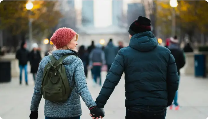 Couple holding hands and walking